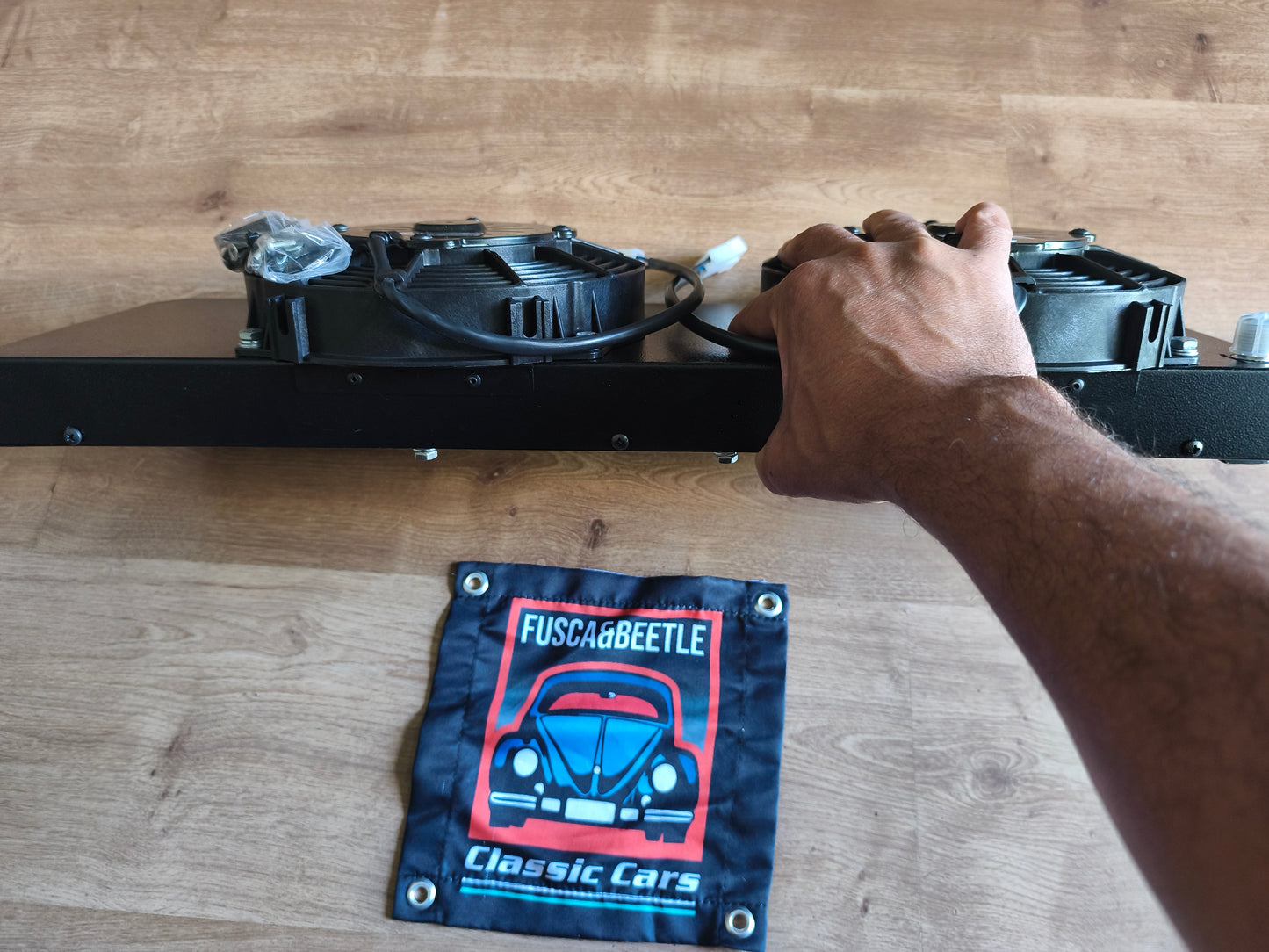 Electric air conditioning condenser for a VW Beetle, mounts behind the spare tire with no modifications required.