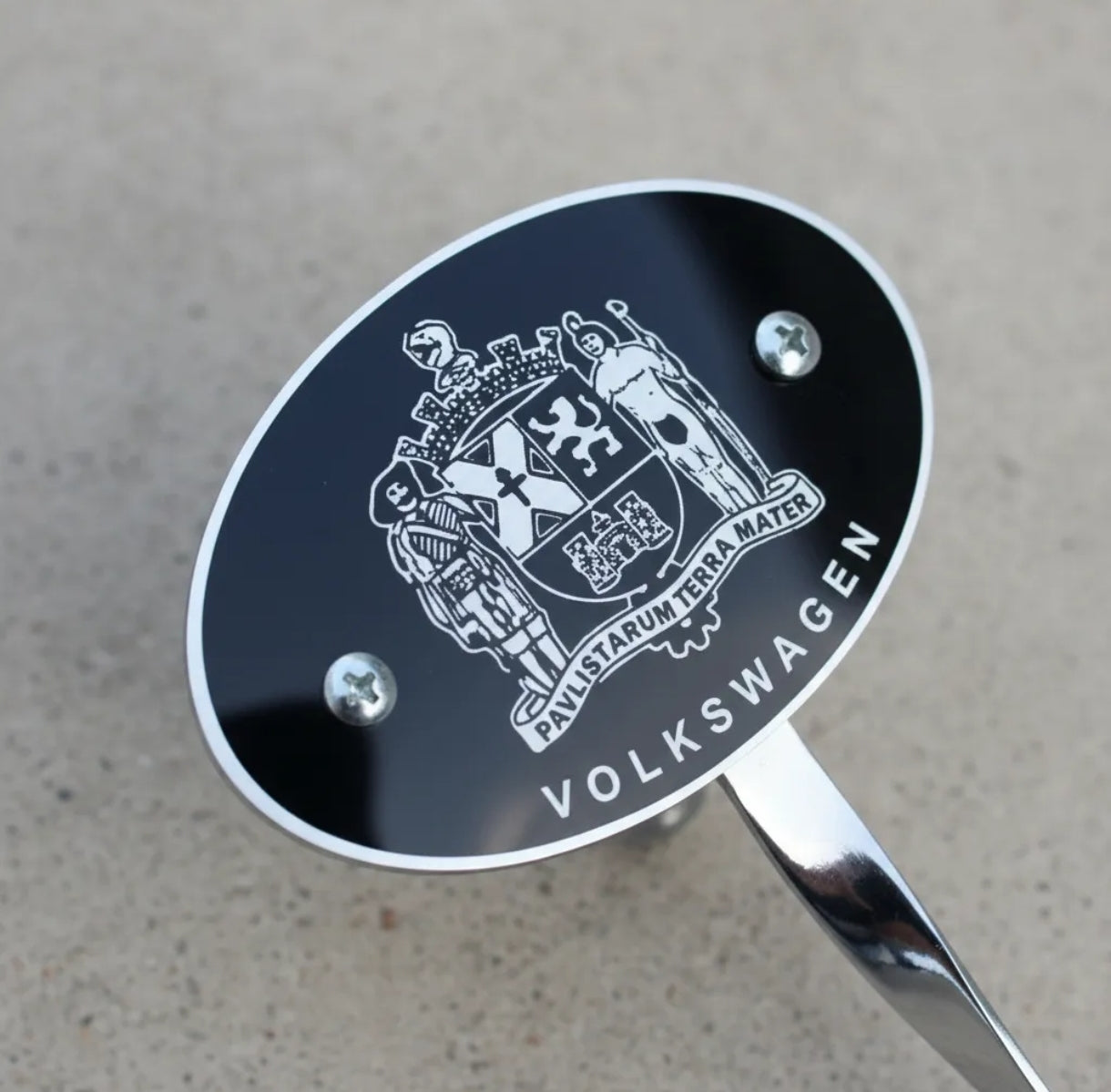 VW Beetle bumper plate with old Beetle family symbol