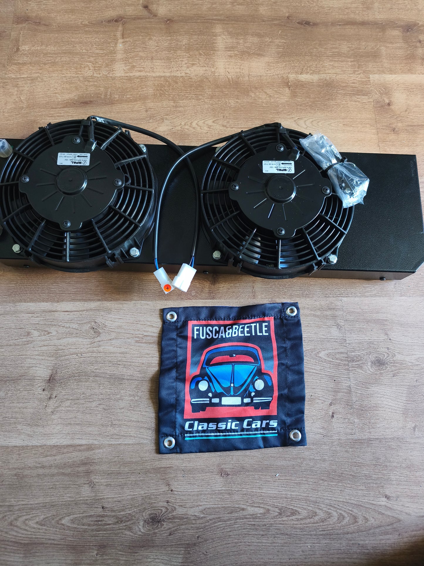Electric air conditioning condenser for a VW Beetle, mounts behind the spare tire with no modifications required.