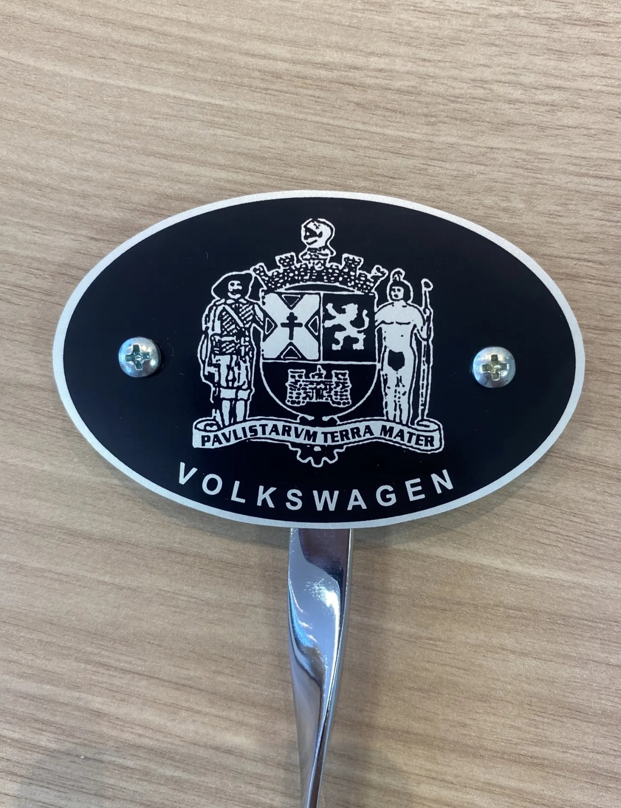 VW Beetle bumper plate with old Beetle family symbol